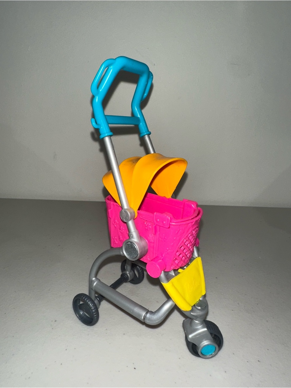 Bright Pink & Yellow Stroller Toy with Blue Handle